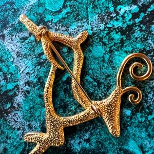 Brooch Deer Gold Colored with rhinestones.